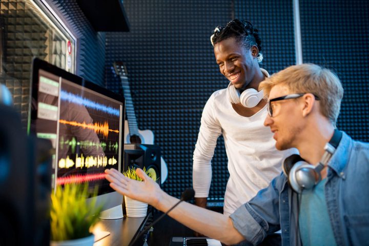 young-musician-or-producer-showing-african-man-gro-ZNGU3XD.jpg